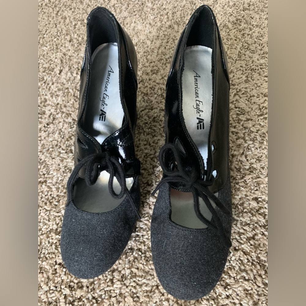Charcoal grey lace up shoes.